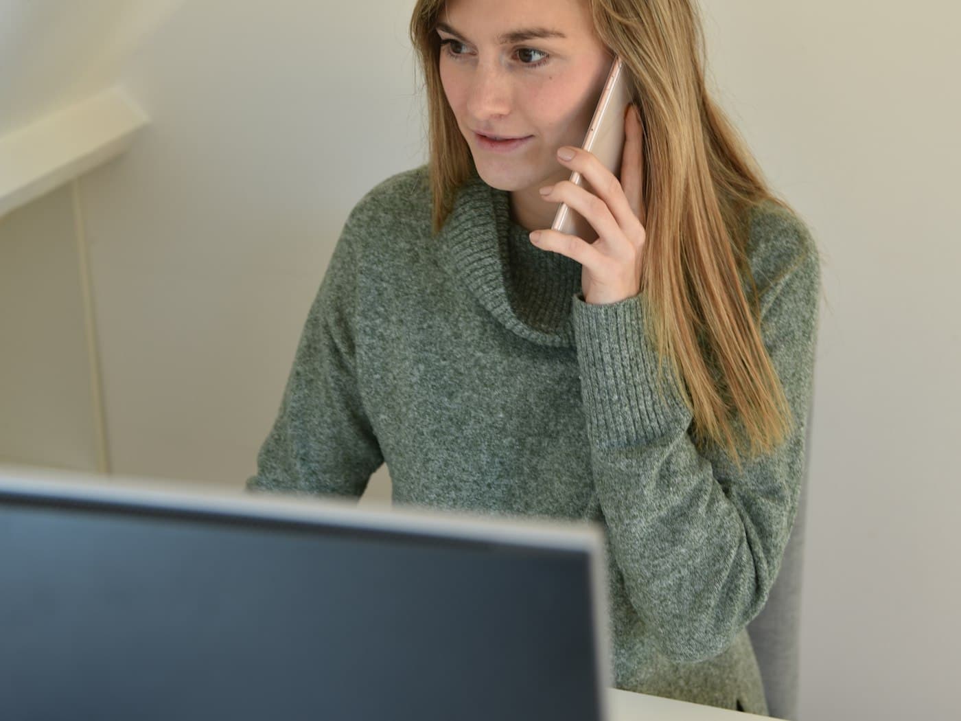 Team member taking a client call at a desk